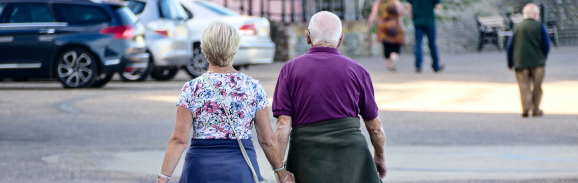 Older coupling walking down the street